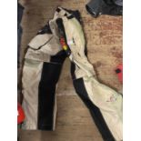A pair of Kini motorbike trousers size 28