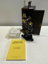 A vintage cased microscope R&J Beck of London Ltd, shipping unavailable