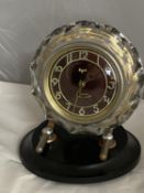 A vintage USSR Majak mantel clock with bakelite base and glass surround. Not ticking