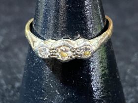 A 9ct gold and three stone diamond ring. 1.38 grams