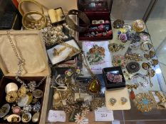 A shelf full of vintage costume jewellery