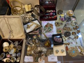A shelf full of vintage costume jewellery