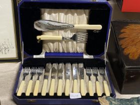 A cased vintage set of fish knives & forks