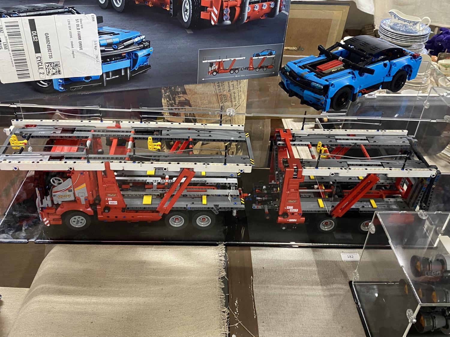 A Lego Technic Car Transporter model 42098 in display case, with original box etc, shipping