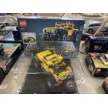 A Lego Technic Jeep Wrangler in display case model 42122 with original box etc, shipping unavailable