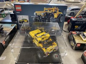 A Lego Technic Jeep Wrangler in display case model 42122 with original box etc, shipping unavailable