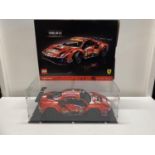A Lego Technic Ferrari 488GTE model 42125 in display case, with original box etc, shipping