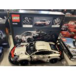 A Lego Technic Porsche 911 RSR model 42096, with original box etc, shipping unavailable