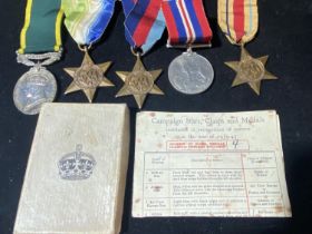 A grouping of WW2 medals & a Territorial efficiency medal awarded to Craftsman J Stringer Royal