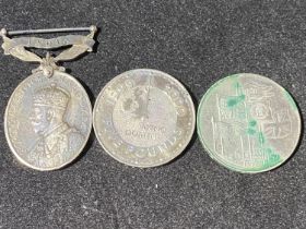 Two collectible £5 coins and a George V India Efficiency medal awarded to PTE J Slade 2nd battalion,