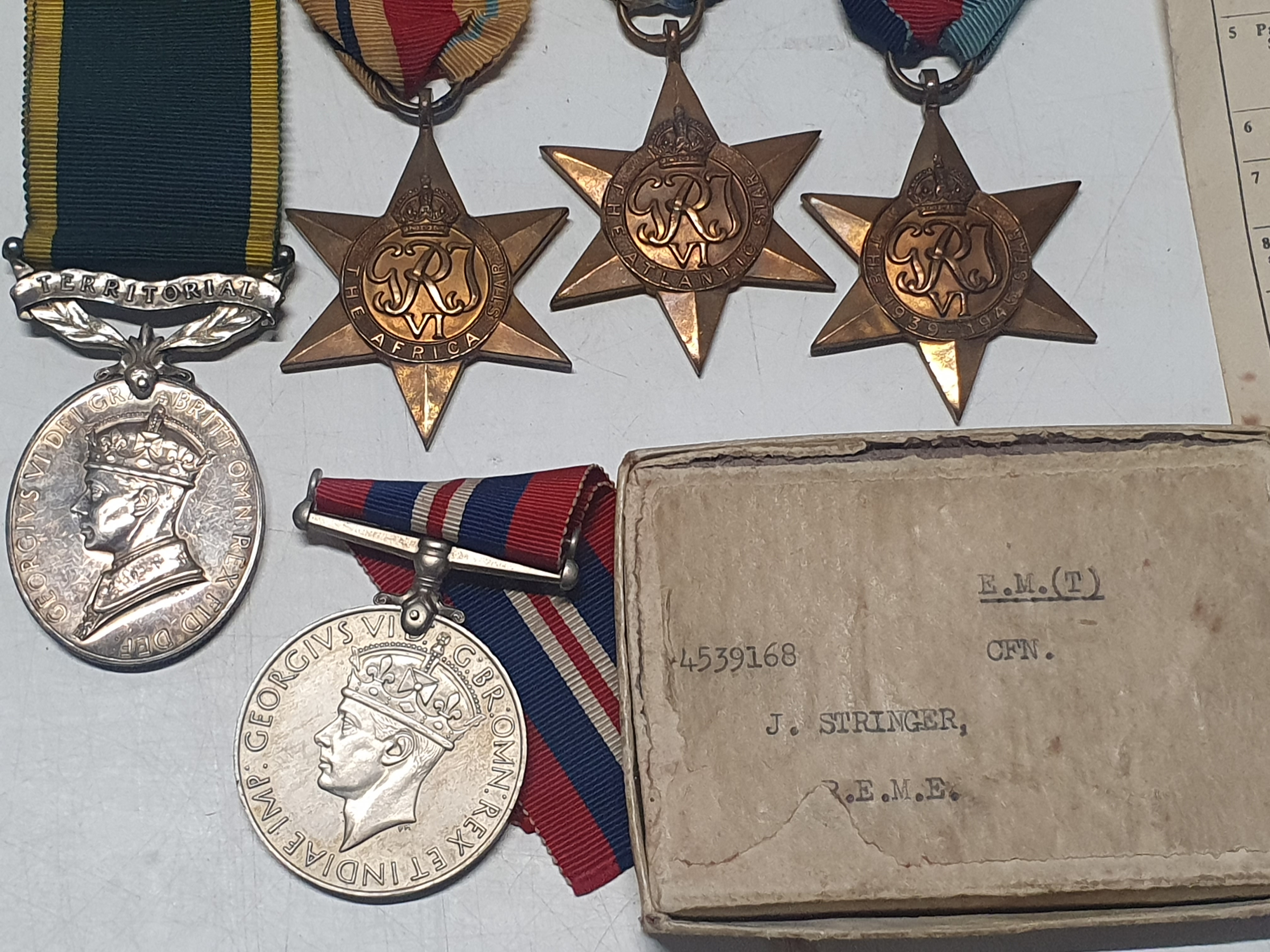 A grouping of WW2 medals & a Territorial efficiency medal awarded to Craftsman J Stringer Royal - Image 3 of 5