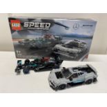 A Lego Speed Champions Mercedes AMG F1 W12E Performance & Mercedes AMG model 76909, with original