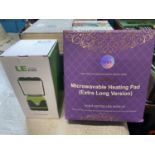 A boxed LED camping lantern (untested) and microwaveable heating pad