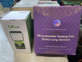 A boxed LED camping lantern (untested) and microwaveable heating pad