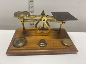 A set of post office style scales and weights