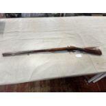 A Pedersoli & Mortimer flintlock single shot shotgun. Black powder only. Serial number 49996.