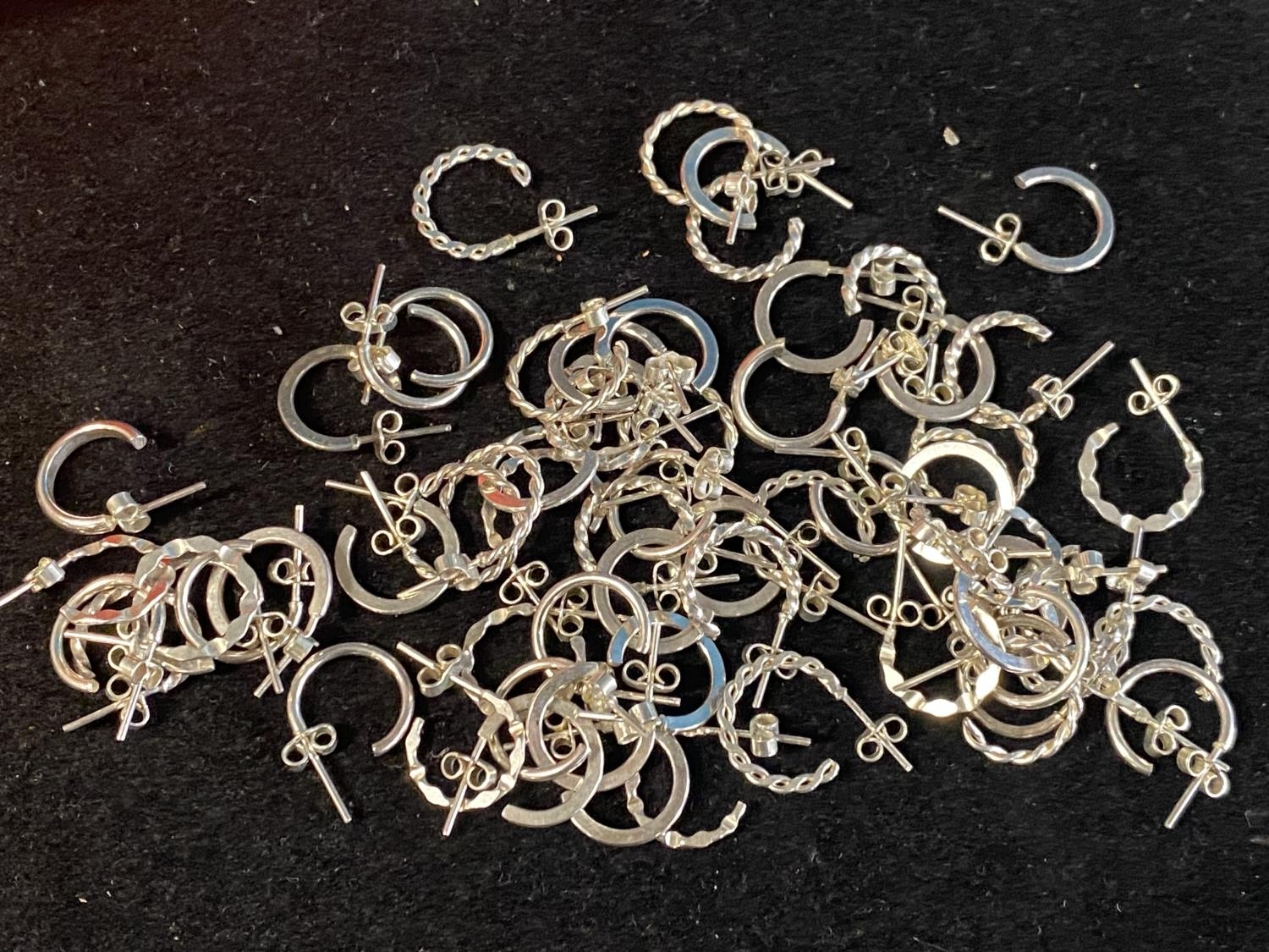 A job lot of new white metal earrings