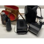 Two vintage Polaroid cameras and a pair of Zenith 10x50 binoculars