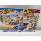 A boxed Hot Wheels advent calendar (8 cars and 16 accessories)