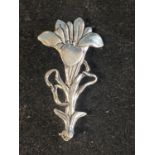 A vintage MASJ pewter and silver plated brooch