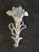 A vintage MASJ pewter and silver plated brooch