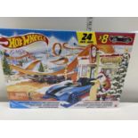 A boxed Hot Wheels advent calendar (8 cars and 16 accessories)