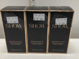 Three boxed Show body shimmer oils