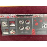 A cased set of four Royal Poppy Collection coins by Jacqueline Hurley