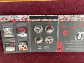 A cased set of four Royal Poppy Collection coins by Jacqueline Hurley
