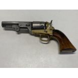 A reproduction 1849 Colt pocket muzzle loading revolver with a leather holster. Curret Firearms