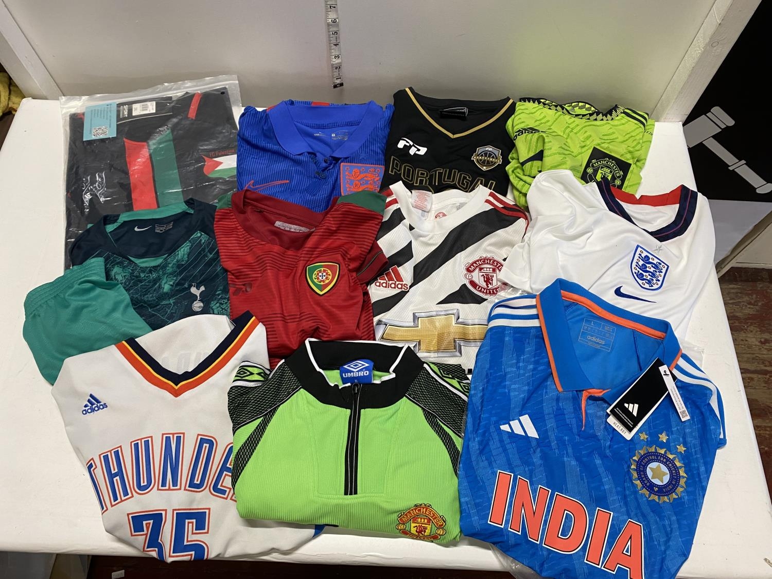 A job lot of assorted size football shirts (unauthenticated)