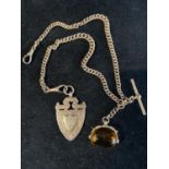 A 9ct gold double Albert chain with a spinning fob and a 9ct gold pendant, total weight 35.18g