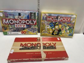 Three assorted boxed Monopoly board games (unchecked)