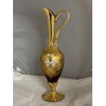 A quality hand decorated bohemian glass ewer with gilt decoration.40cm tall.