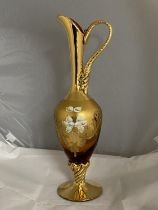A quality hand decorated bohemian glass ewer with gilt decoration.40cm tall.