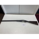 A antique W.R. Pape (Newcastle Upon Tyne) side by side 12 bore shotgun. Current Shotgun