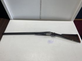 A antique W.R. Pape (Newcastle Upon Tyne) side by side 12 bore shotgun. Current Shotgun
