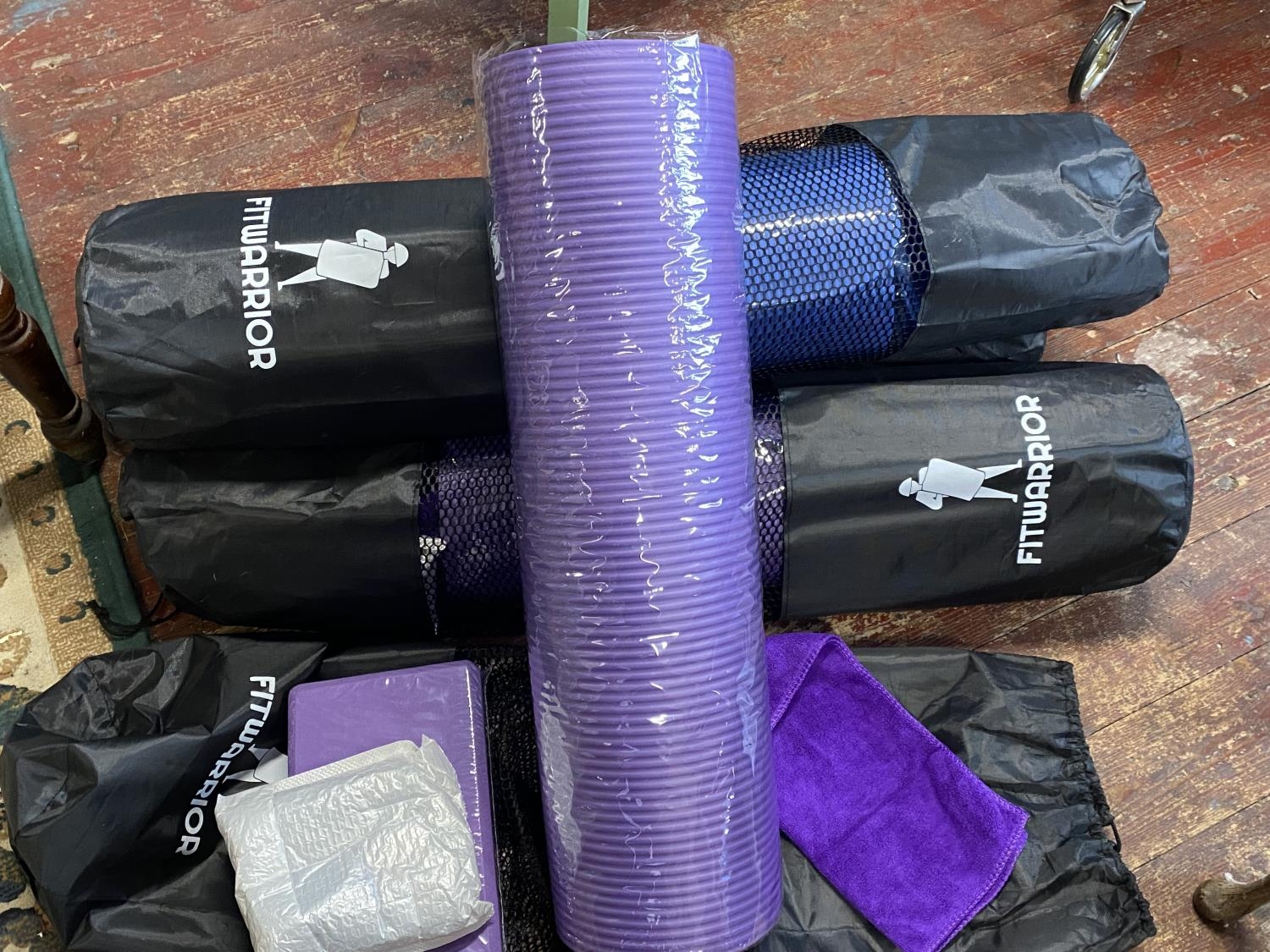 Four new Fitwarrior yoga mat kits including mat, skipping rope towel and foam brick, shipping