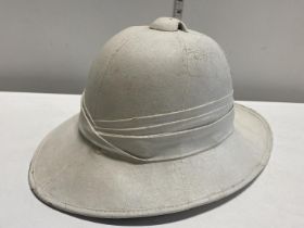 A WW2 Pith helmet by Failsworth Hats Ltd dated 1942 with broad arrow