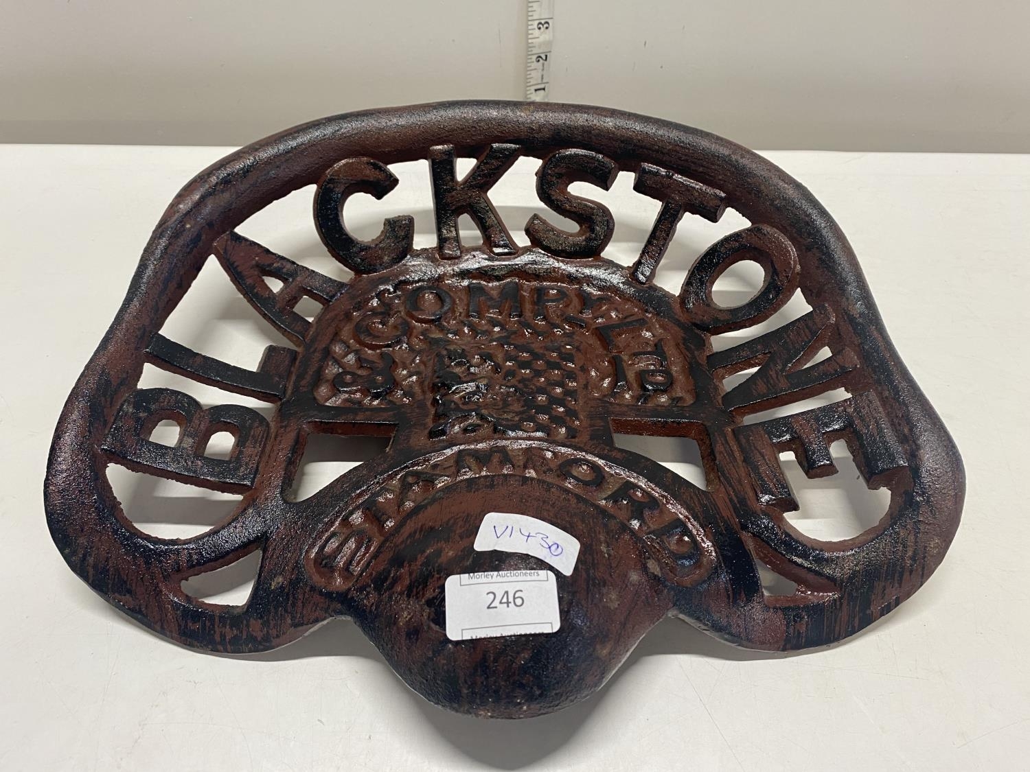 A reproduction cast iron Blackstone tractor seat