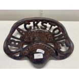 A reproduction cast iron Blackstone tractor seat