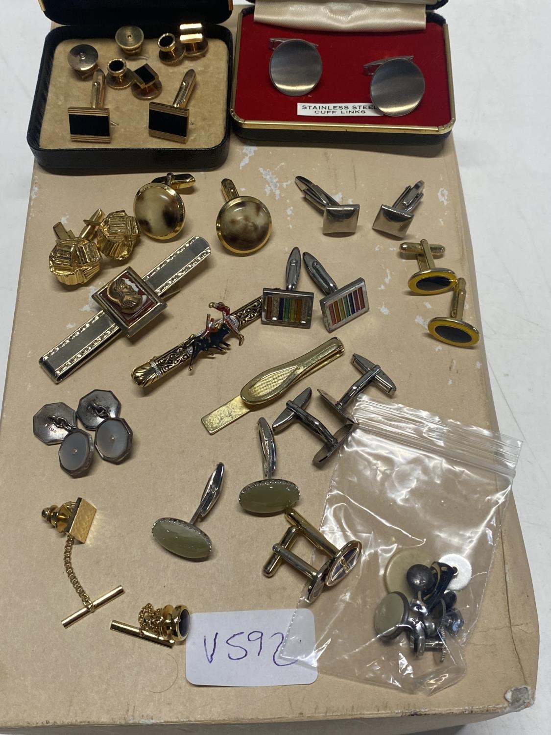 A large selection of assorted vintage cufflinks, tie clips etc