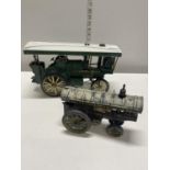 One tin plate steam engine model and one smaller cast iron tin plate model