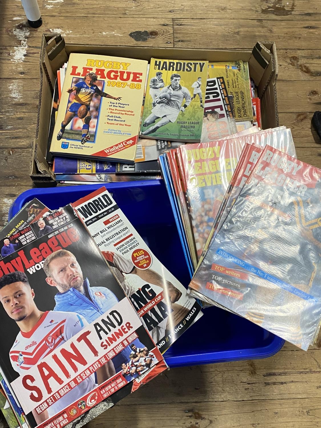 Two boxes full of assorted vintage Rugby league programmes and other items