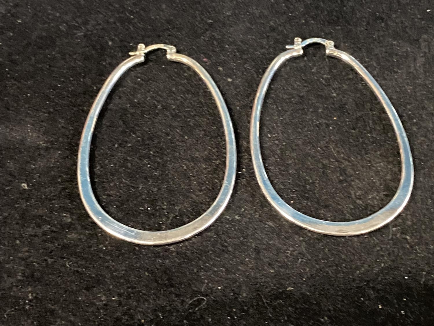 A pair of stamped 925 large silver hoop earrings. 7.5cm tall