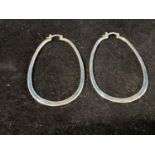 A pair of stamped 925 large silver hoop earrings. 7.5cm tall