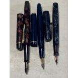 Three assorted vintage fountain pens all with 14ct gold nibs