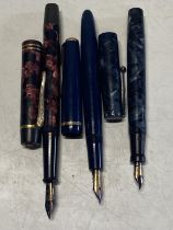 Three assorted vintage fountain pens all with 14ct gold nibs