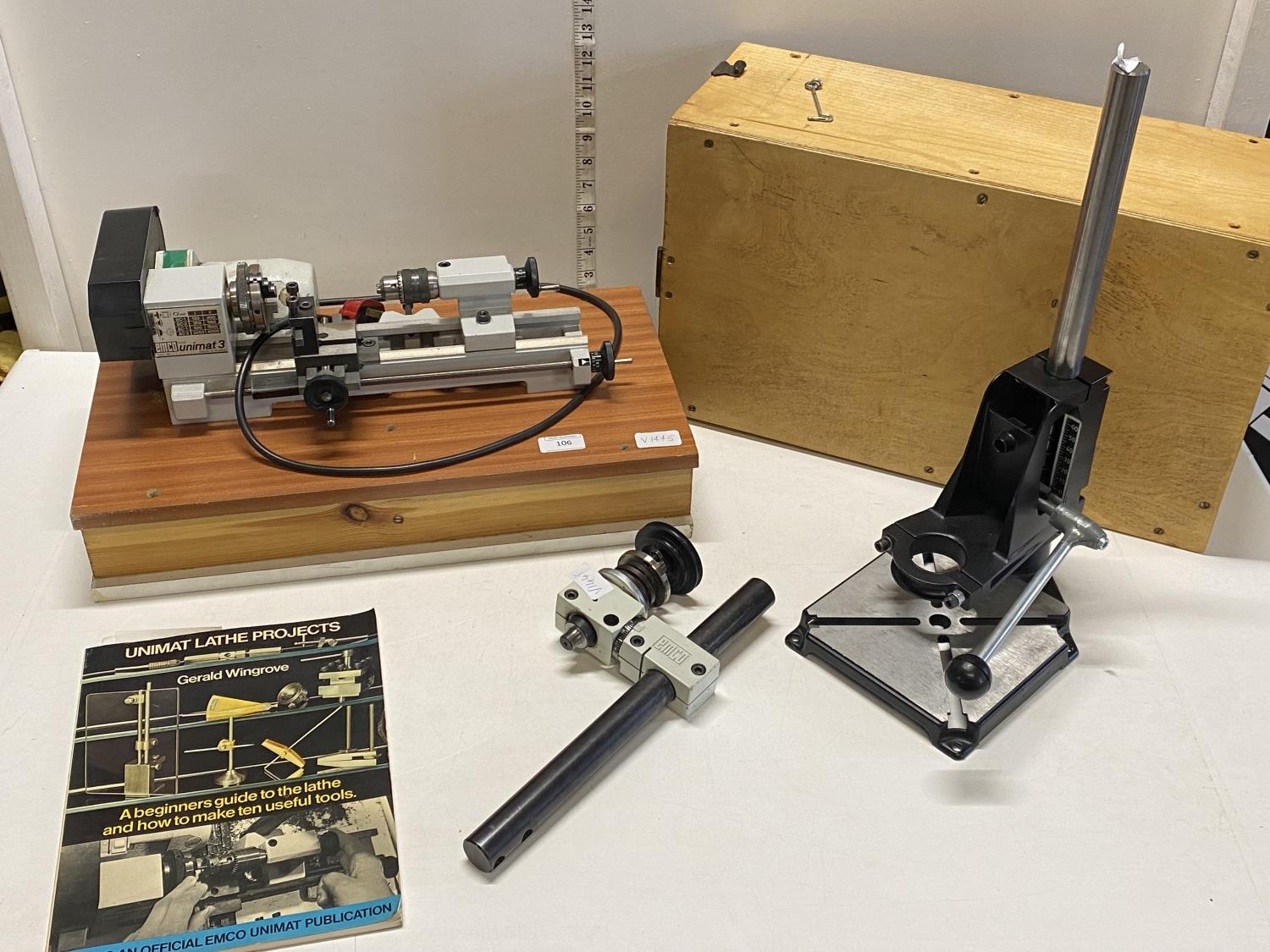 An EMCO Unimat 3 watch makers lathe with accessories mounted on custom built box in working order,