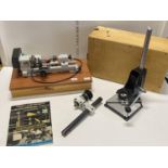 An EMCO Unimat 3 watch makers lathe with accessories mounted on custom built box in working order,